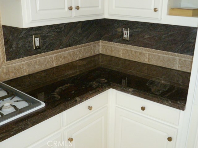 48 Cedar Tree Lane Irvine, CA 92612 - Photo 10 of 52 a close view of a stove and microwave
