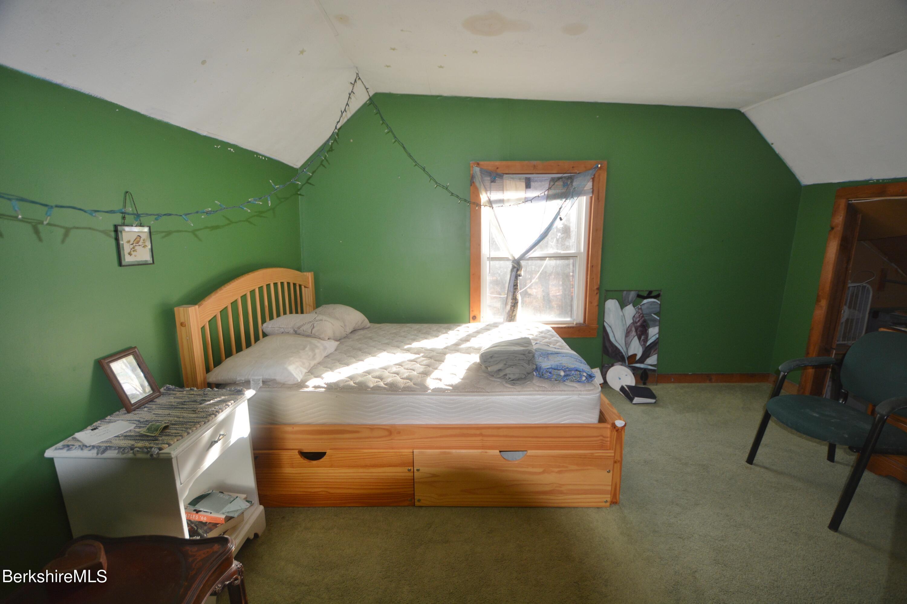 170 Giles Road Otis, MA 01253 - Photo 6 of 10 a bedroom with a bed and furniture