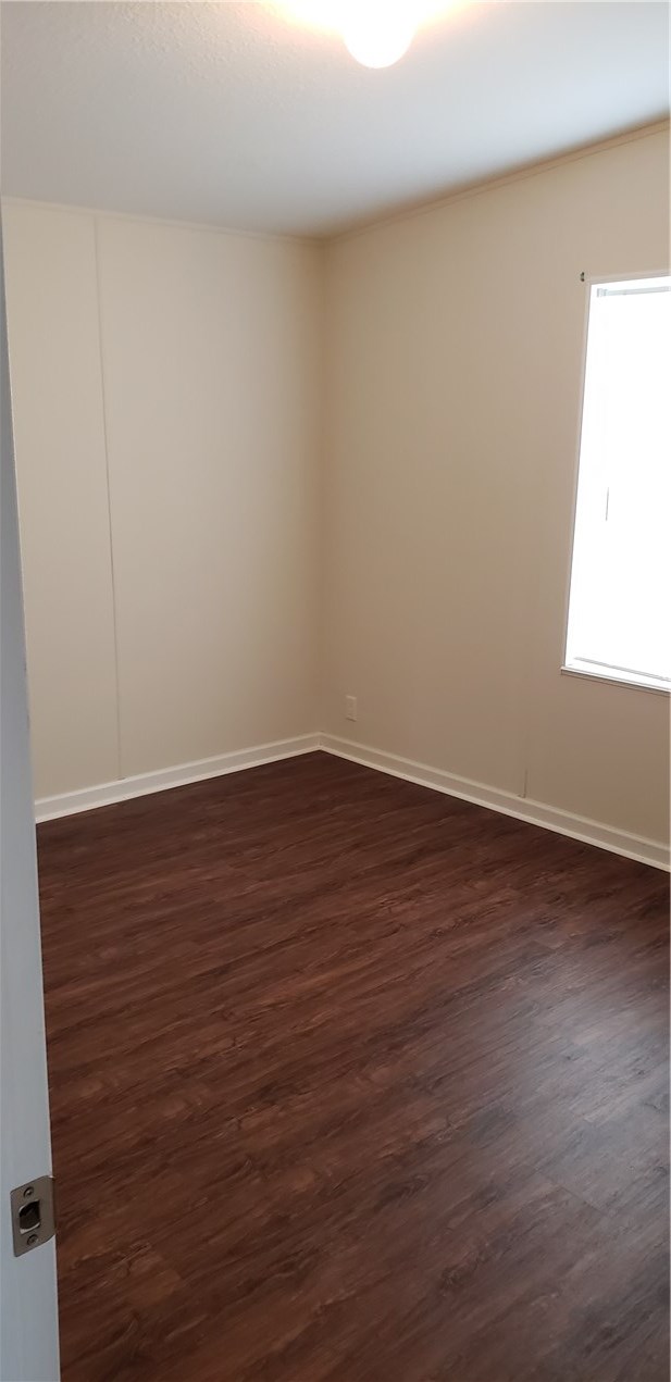 13465 Yellow Bluff Road Jacksonville, FL 32226 - Photo 20 of 30 a view of an empty room with wooden floor and a window