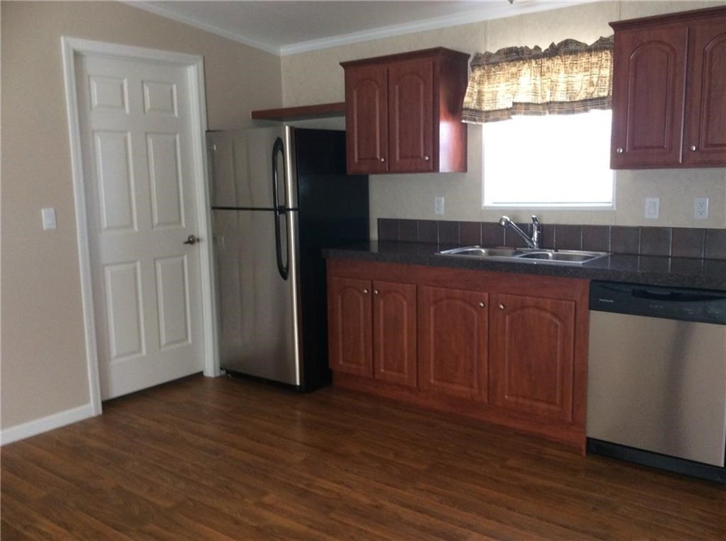 13465 Yellow Bluff Road Jacksonville, FL 32226 - Photo 8 of 30 a kitchen with a refrigerator and window