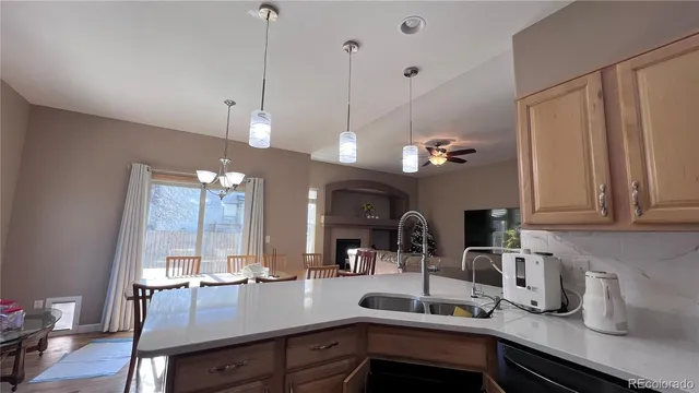 a kitchen with sink and window
