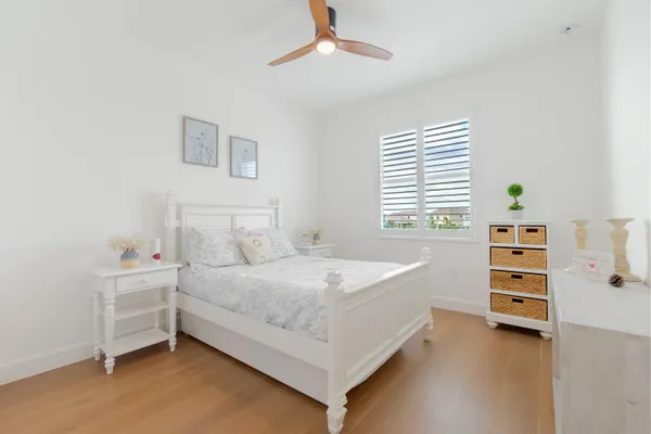 a bed room with a bed and a window