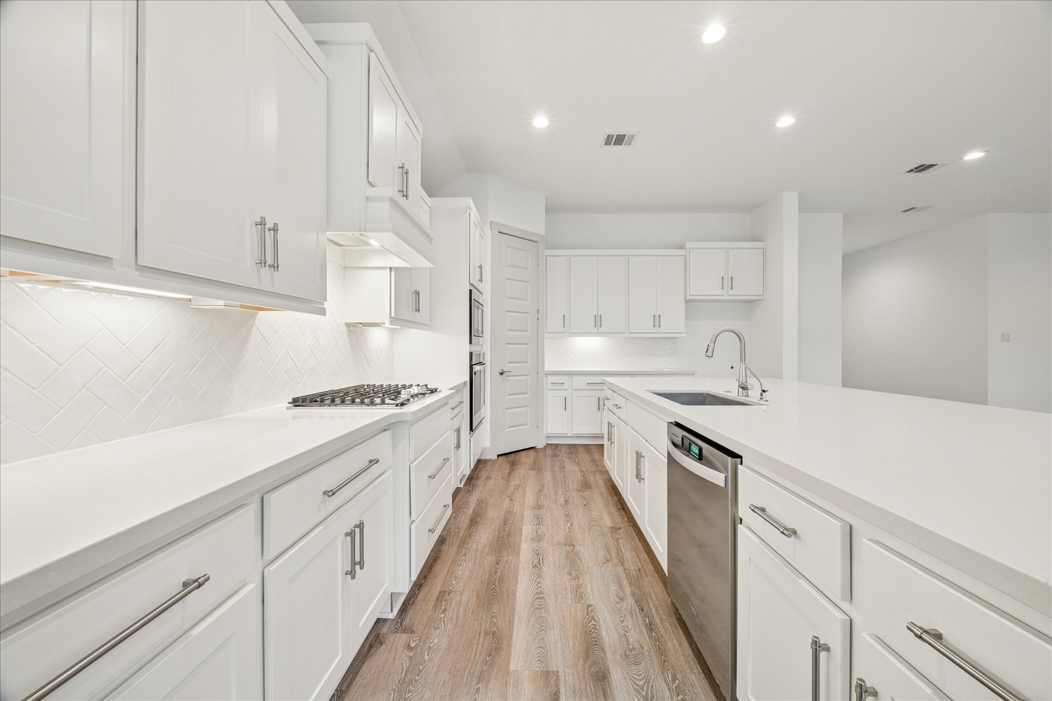 2550 Austin Trail Friendswood, TX 77546 - Photo 11 of 35 The kitchen has ample countertop space, a gas cooktop, soft close drawers and stainless appliances.