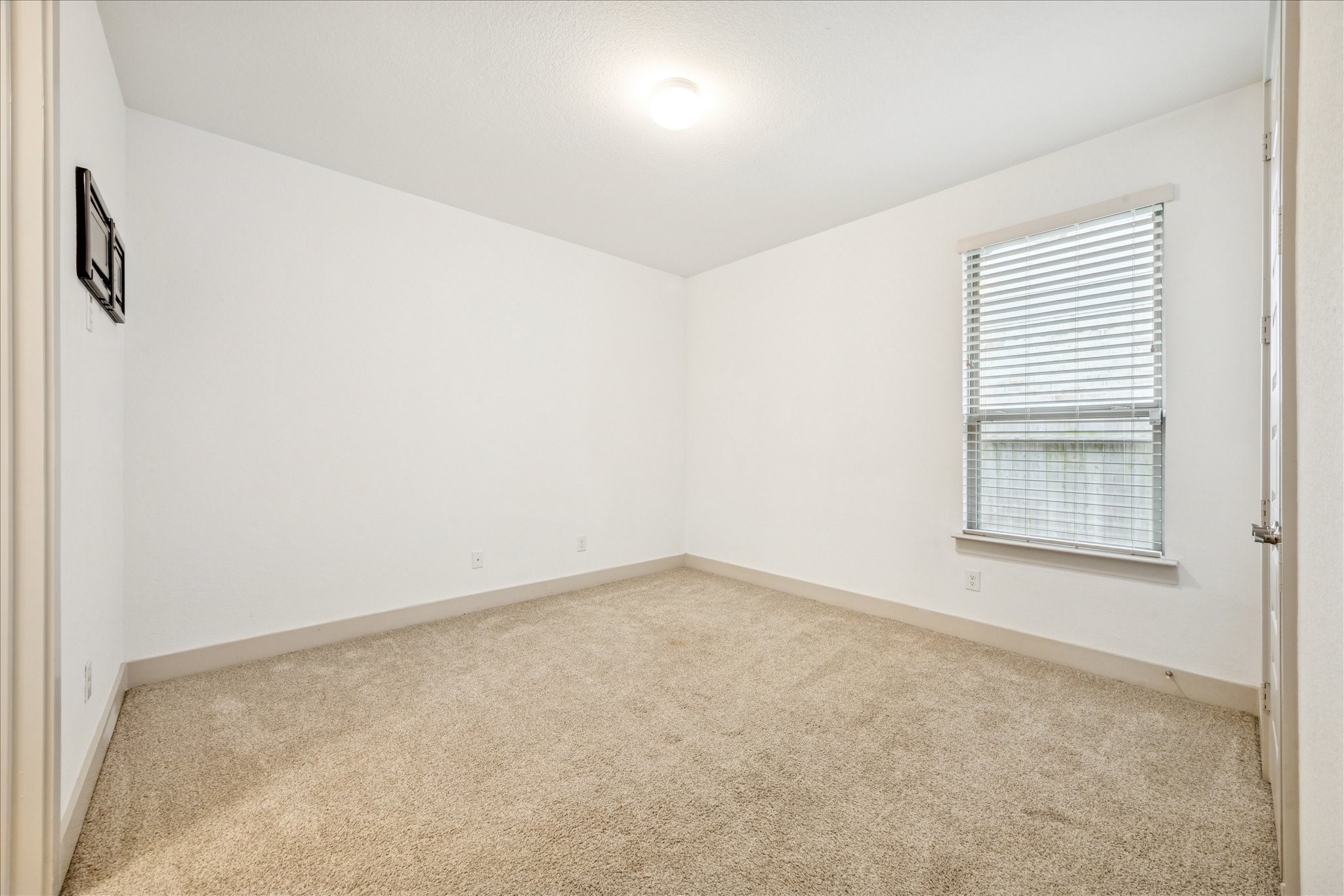 2550 Austin Trail Friendswood, TX 77546 - Photo 22 of 35 A secondary bedroom. This one is connected to one of the secondary bathrooms.