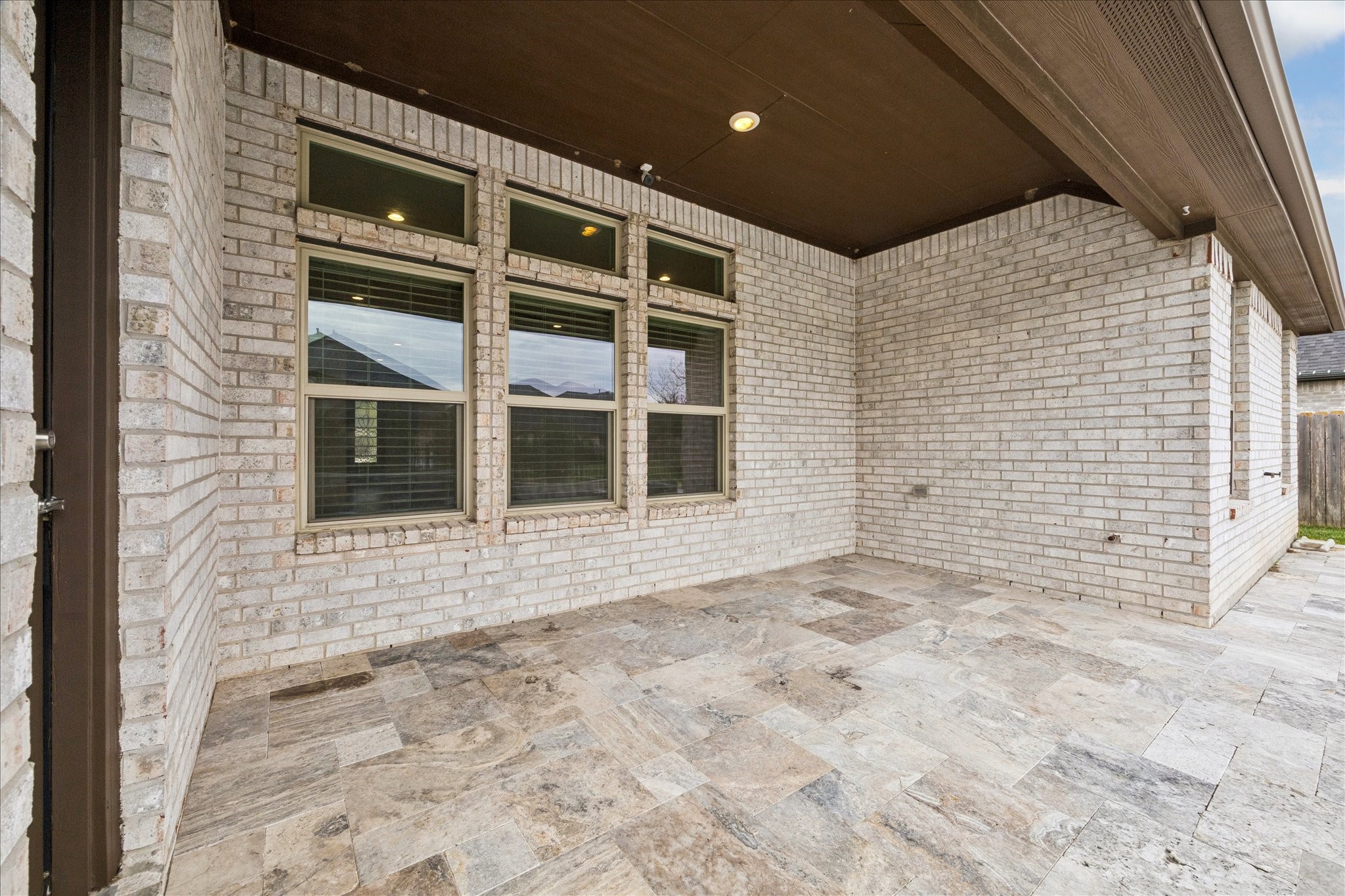 2550 Austin Trail Friendswood, TX 77546 - Photo 28 of 35 The covered back patio is another great space to entertain or relax in the morning with a cup of coffee or in the evening with a glass of wine.