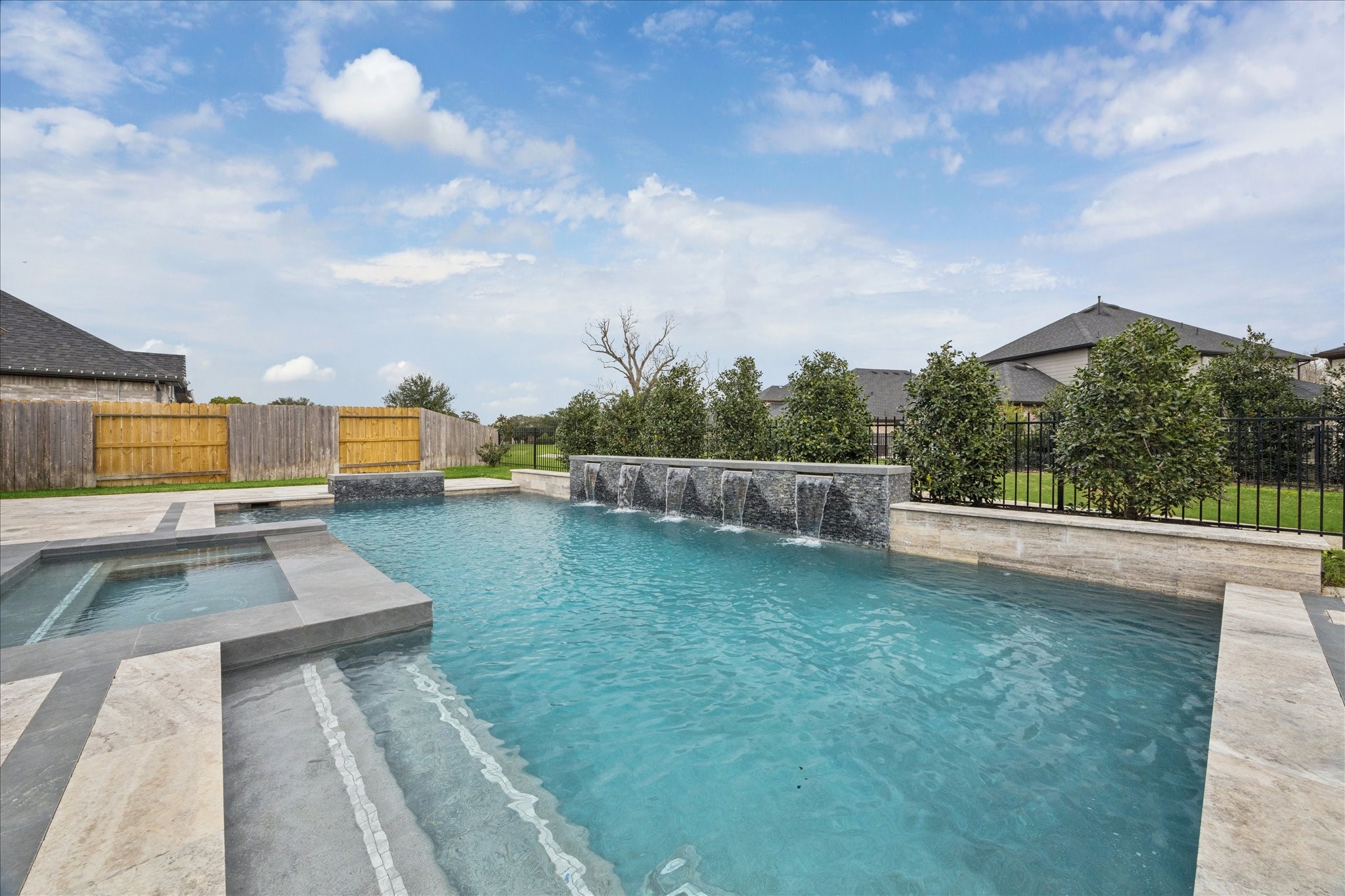 2550 Austin Trail Friendswood, TX 77546 - Photo 30 of 35 This pool/spa are stunning and no direct back neighbors to share a fence with!