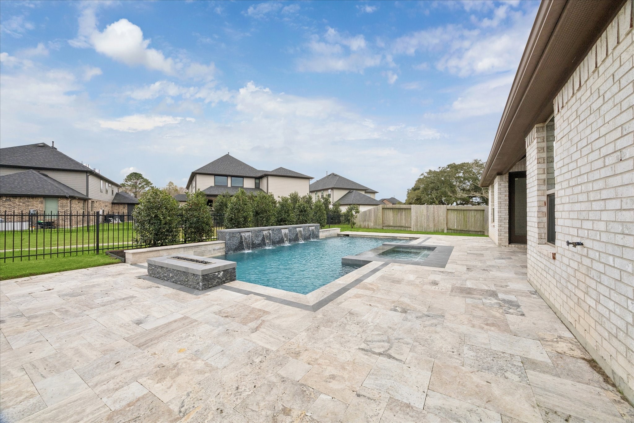 2550 Austin Trail Friendswood, TX 77546 - Photo 5 of 35 The pool/spa and fire pit were built by McKinney Custom Pools in 2022.