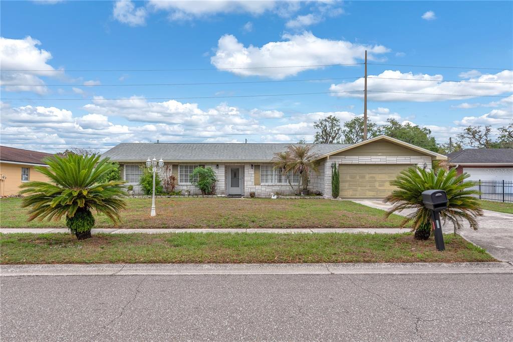 3420 Yale Circle Riverview, FL 33578 - Photo 1 of 30 a front view of a house with a garden and outdoor seating