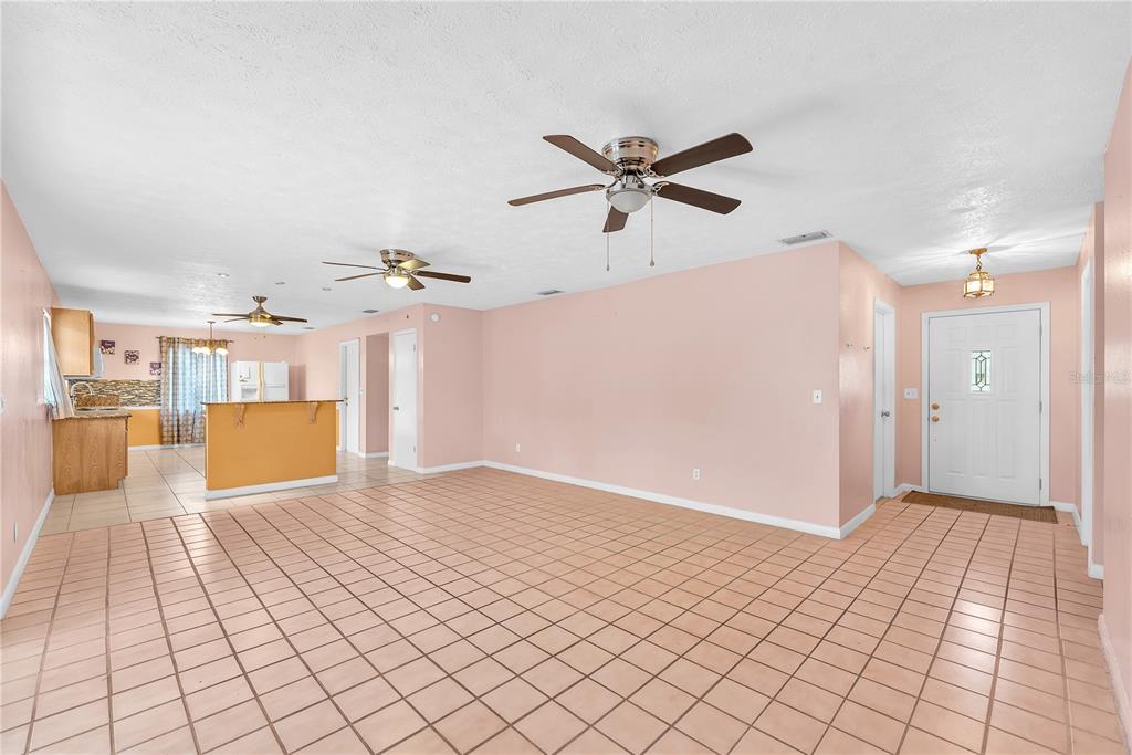 3420 Yale Circle Riverview, FL 33578 - Photo 3 of 30 a view of a livingroom with a ceiling fan and window