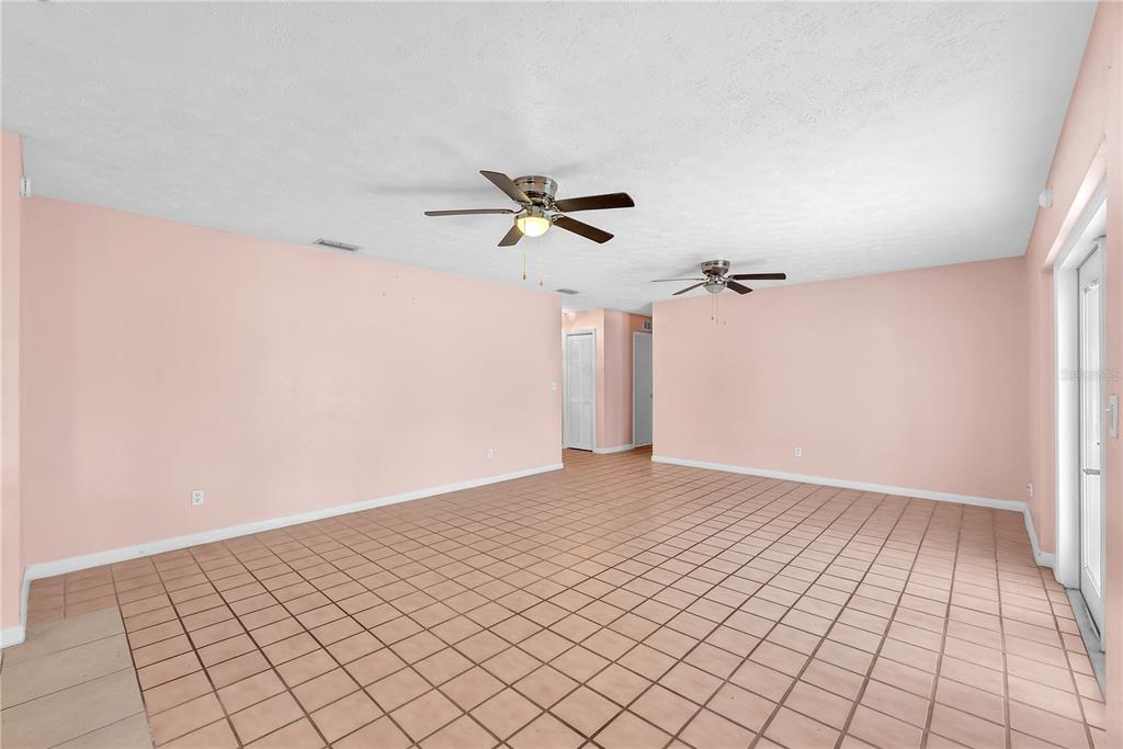 3420 Yale Circle Riverview, FL 33578 - Photo 5 of 30 an empty room with a ceiling fan and window