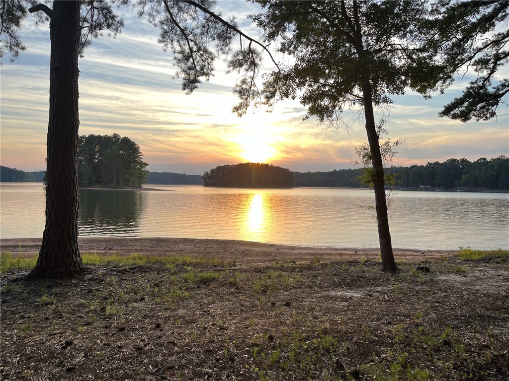 474 Overlook Drive Fair Play, SC 29643 - Photo 10 of 10 Golden light on the water at sunset creates a breathtaking waterfront vista.