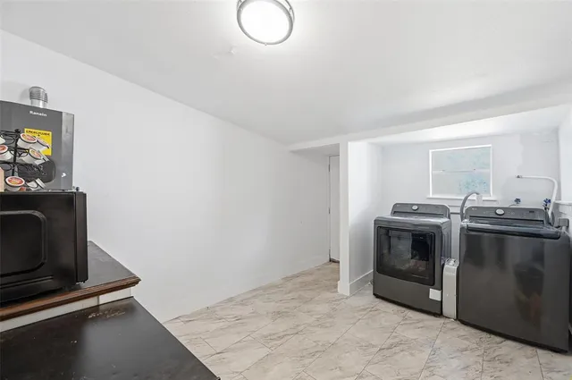a stove top oven sitting inside of a kitchen