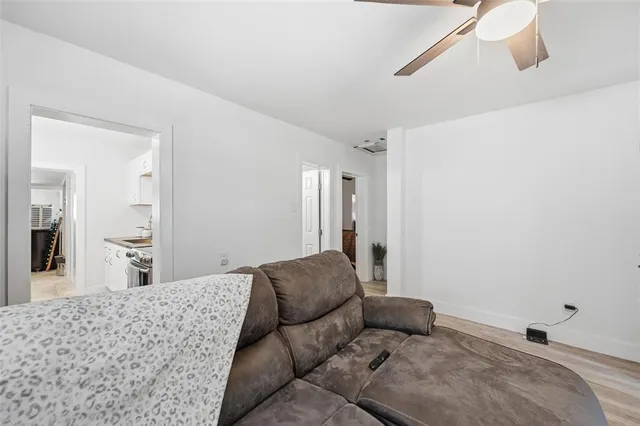 a bedroom with a bed and ceiling fan