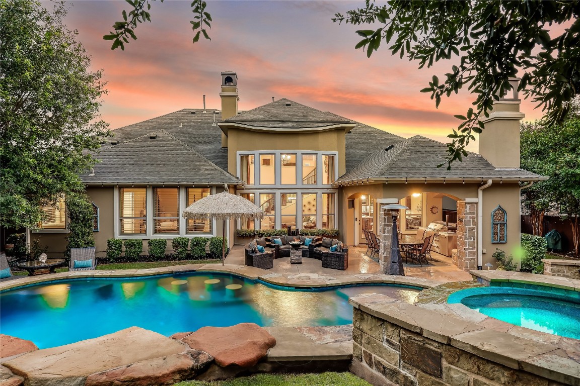 709 SANTALUZ Path Austin, TX 78732 - Photo 1 of 1 a view of a house with swimming pool and chairs