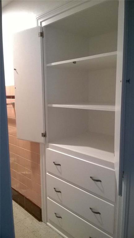 979 Mayfield Road Sharpsville, PA 16150 - Photo 14 of 25 Linen closet in main floor bath with deep shelves and drawers.