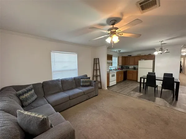 a living room with furniture and a table