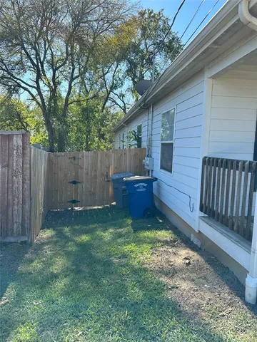 a view of backyard with swimming pool and patio