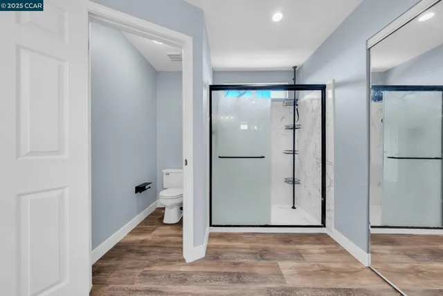 a view of entryway with wooden floor