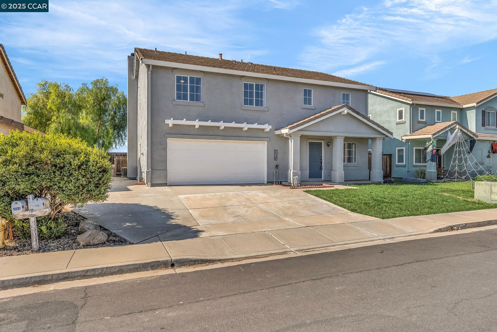Discovery Bay Discovery Bay, CA 94505 - Photo 2 of 21 a front view of a house with a yard and garage