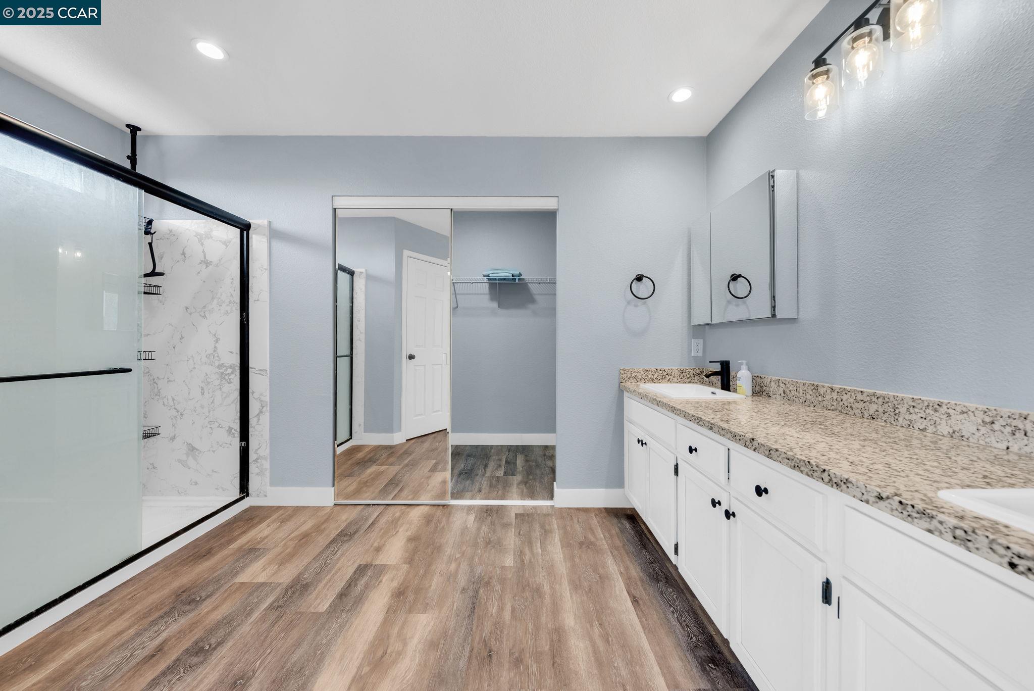 Discovery Bay Discovery Bay, CA 94505 - Photo 9 of 21 a spacious bathroom with a granite countertop sink mirror and shower