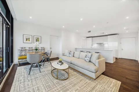 a living room with furniture and a table