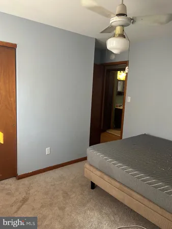 a room with wooden floor and furniture