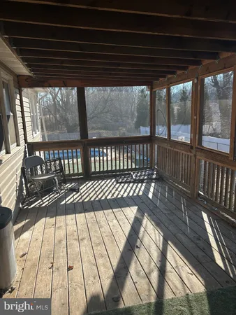 a view of balcony with wooden floor