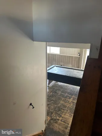 a dining room with kitchen island furniture and a floor to ceiling window