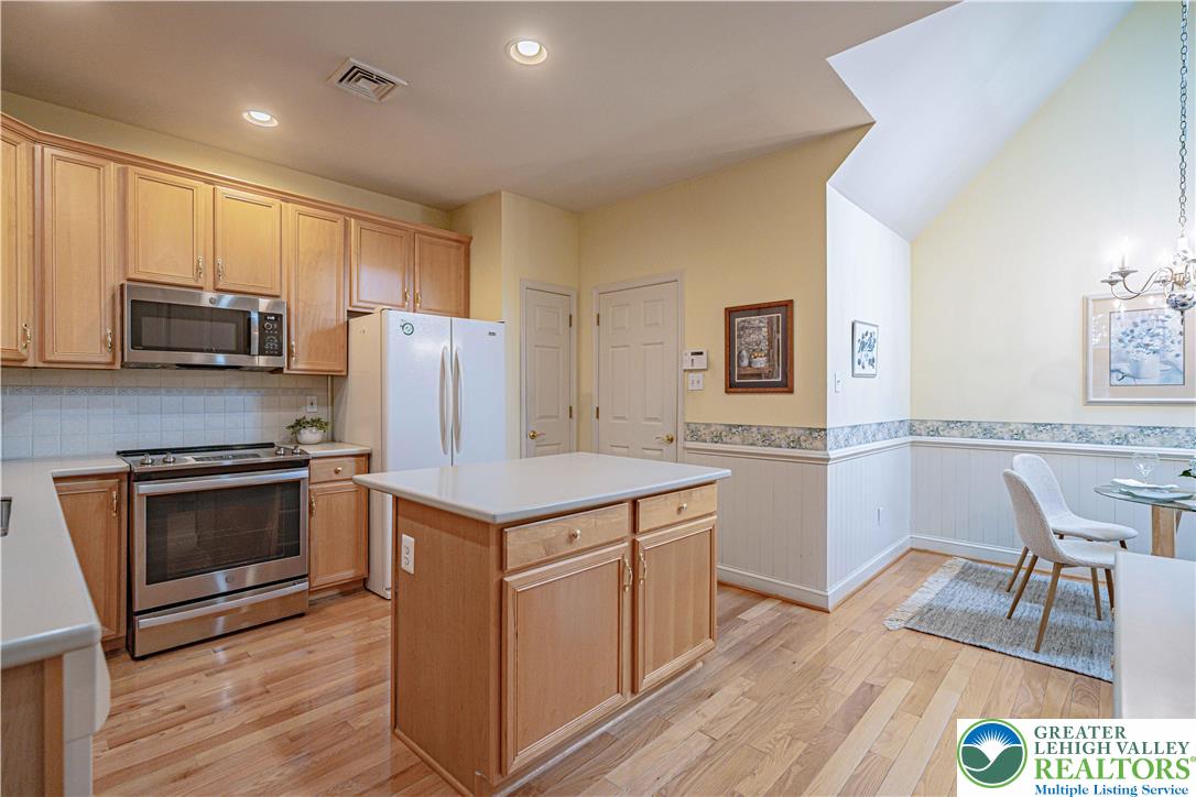 803 Dorset Road Allentown, PA 18104 - Photo 12 of 44 a kitchen with kitchen island a counter top space a sink stainless steel appliances and cabinets