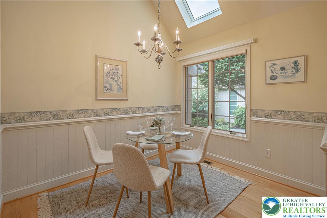 803 Dorset Road Allentown, PA 18104 - Photo 16 of 44 a view of a dining room with furniture a chandelier and wooden floor