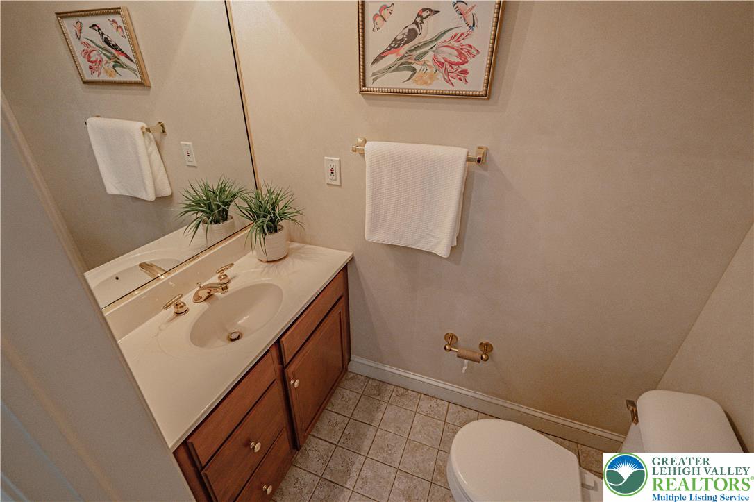 803 Dorset Road Allentown, PA 18104 - Photo 18 of 44 a bathroom with a toilet sink and mirror