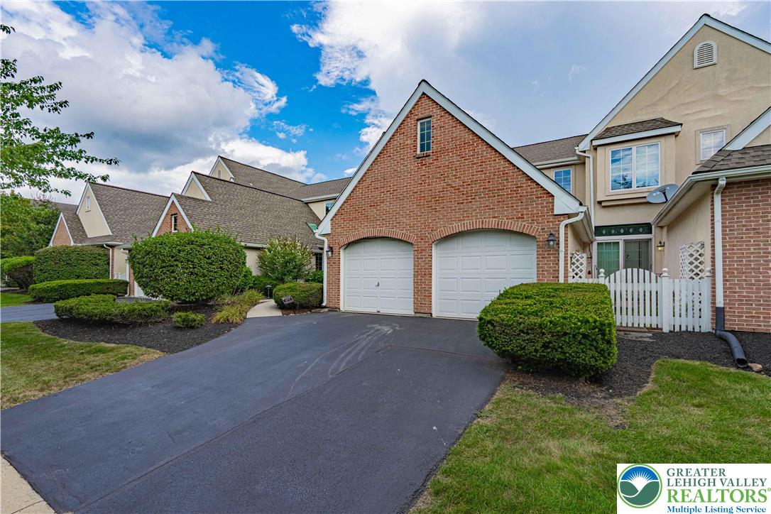 803 Dorset Road Allentown, PA 18104 - Photo 2 of 44 a front view of a house with a garden and plants