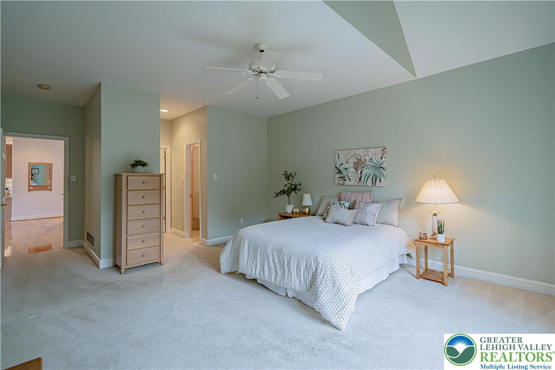 803 Dorset Road Allentown, PA 18104 - Photo 21 of 44 a bedroom with a bed and a lamp