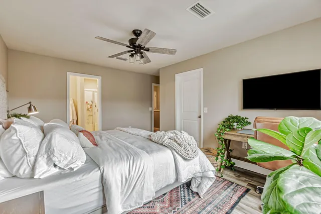 a bedroom with a bed and a couch