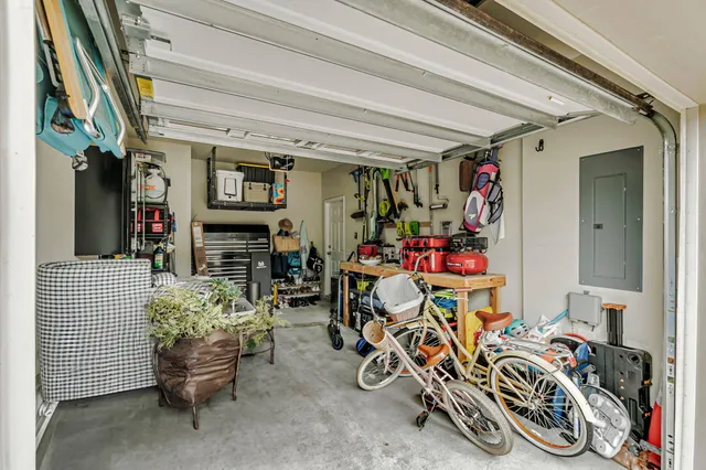 a view of a patio with a table and chairs under an umbrella