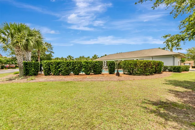 a view of a swimming pool with an outdoor space and seating area