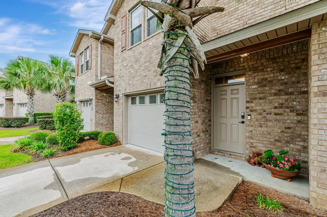 a backyard of a house with potted plants