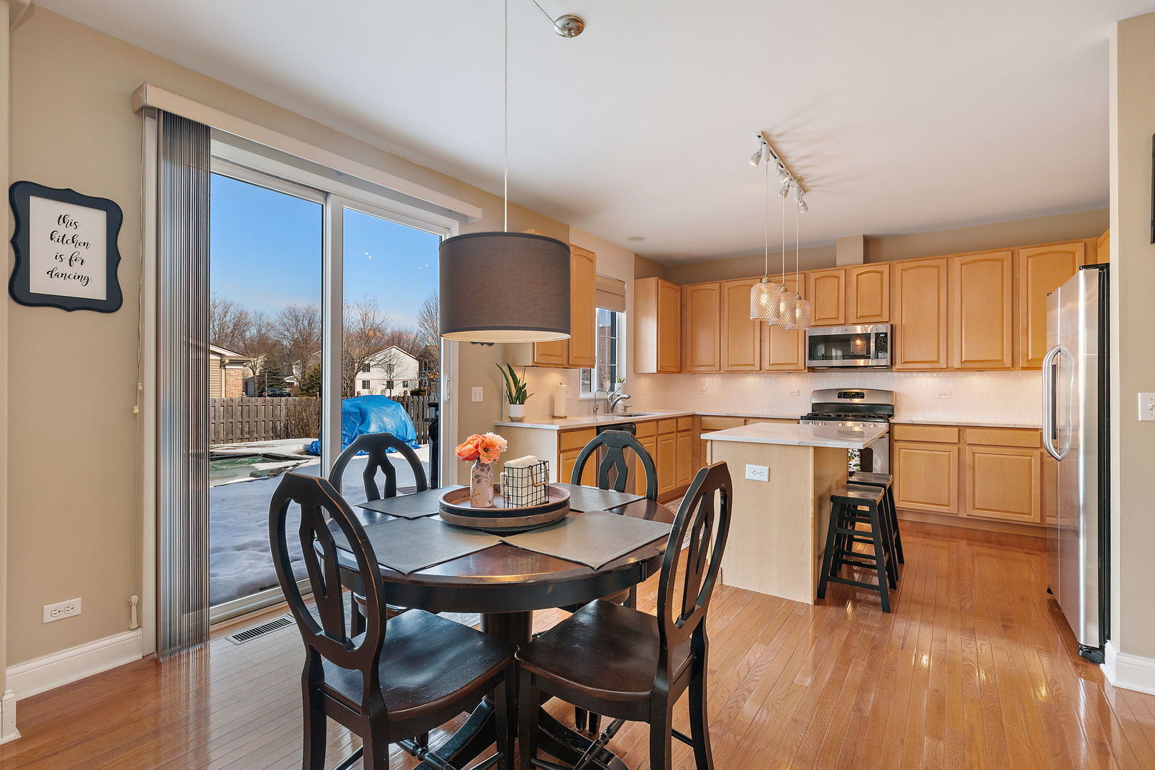1502 Summerhill Lane Cary, IL 60013 - Photo 5 of 17 a view of a dining room with furniture window and wooden floor