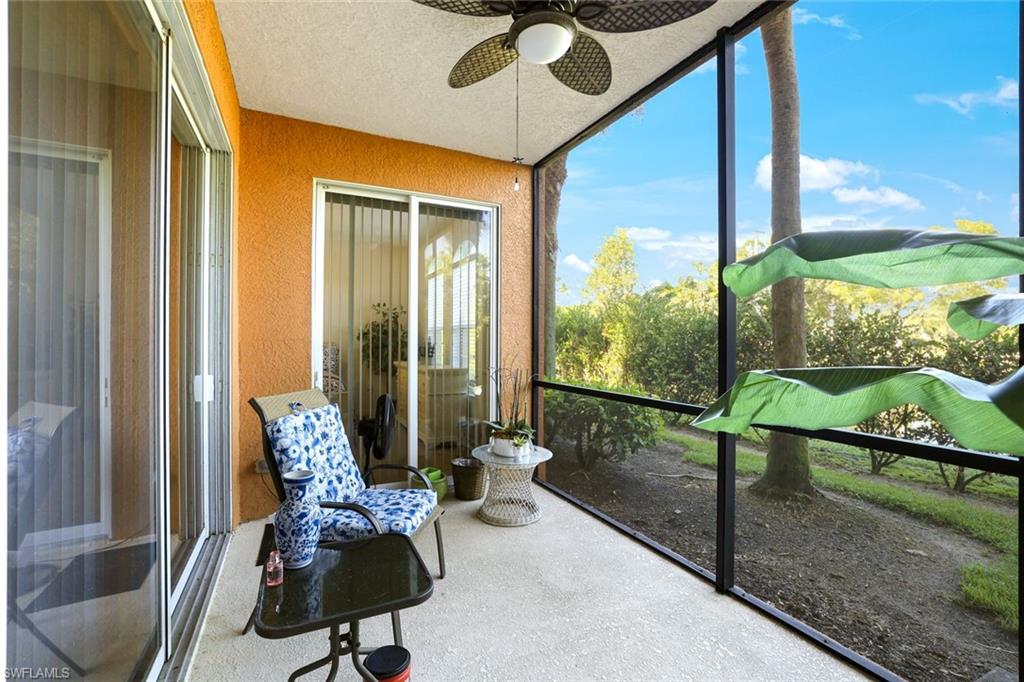 10049 Heather Lane, Unit 101 Naples, FL 34119 - Photo 27 of 28 Sunroom with a textured wall and a textured ceiling