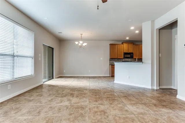 a view of a kitchen with a sink and a microwave