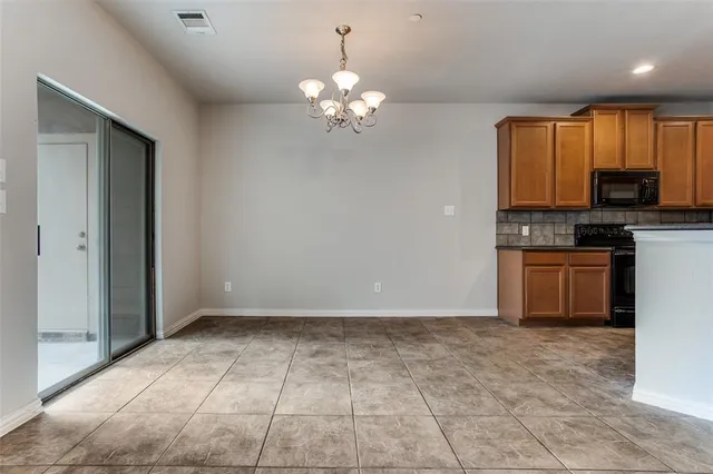 a kitchen with a stove a sink and a refrigerator