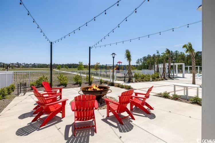 541 Ayrhill Loop Myrtle Beach, SC 29588 - Photo 5 of 8 View of patio / terrace with a fire pit