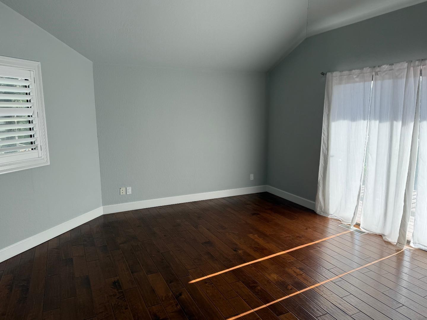 10 Fred Court Scotts Valley, CA 95066 - Photo 5 of 7 an empty room with wooden floor and windows