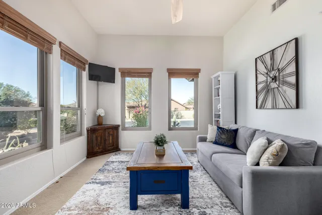 a living room with furniture and a large window