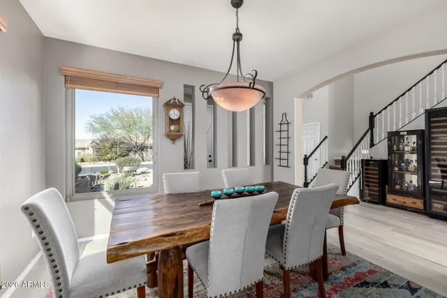 a kitchen with a refrigerator sink and cabinets