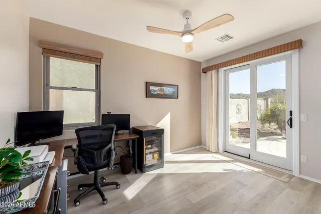 a reading room with furniture and wooden floor