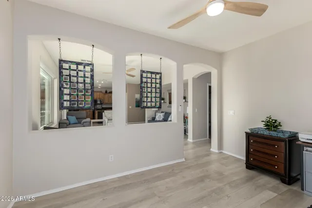 a bedroom with a large bed and a large window