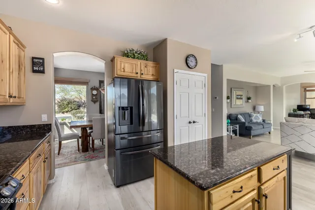 a bedroom with a bed a flat screen tv and a couch