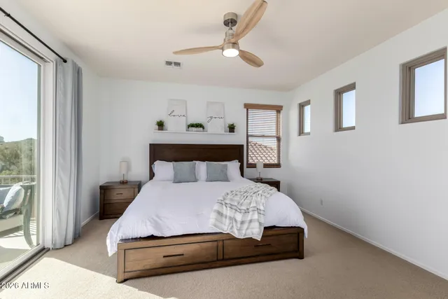 a view of a chairs and table in the back of a building