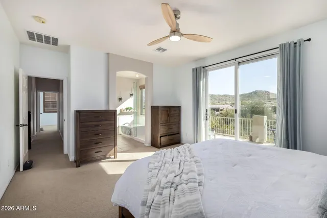 a view of a swimming pool with a patio and plants